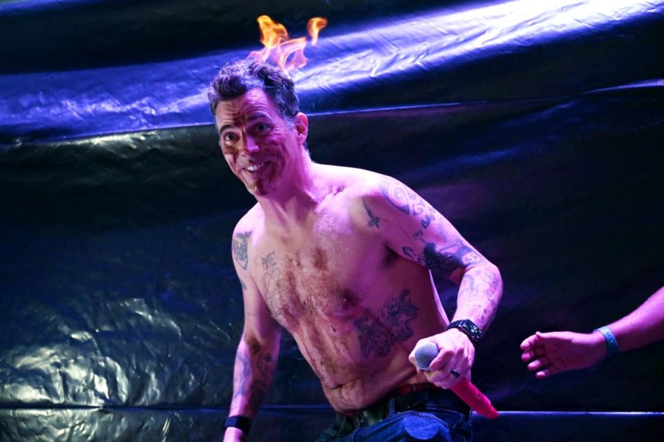 <div class="inline-image__caption"><p>Steve-O lights his hair on fire at the Gathering of the Juggalos</p></div> <div class="inline-image__credit">Nate Igor Smith</div>