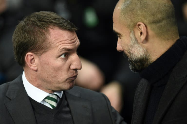 Brendan Rodgers (left) greets Pep Guardiola at the Etihad Stadium in Manchester on December 6, 2016