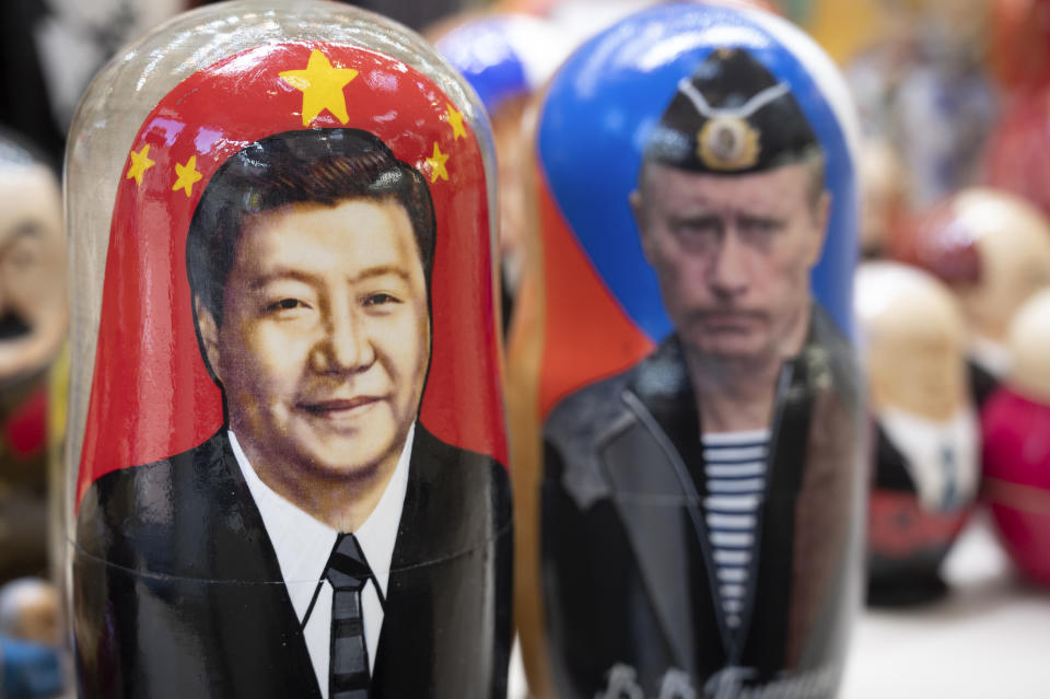 Russian matryoshka dolls with portraits of Chinese President Xi Jinping, left, and Russian President Vladimir Putin are displayed among others for sale at a souvenir shop in Moscow, Russia, Tuesday, March 21, 2023. Chinese President Xi Jinping arrived in neighbouring Russia for a three-day trip for the talks with Russian President Vladimir Putin. (AP Photo/Dmitry Serebryakov)