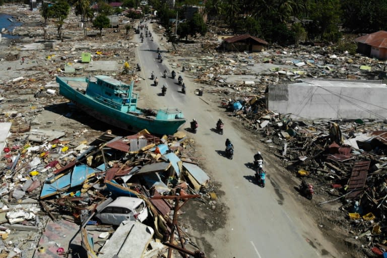 The city of Palu is in ruins, its damaged hospitals overflowing with injured patients and doctors treated the wounded outside in the cracked, rubble-strewn streets