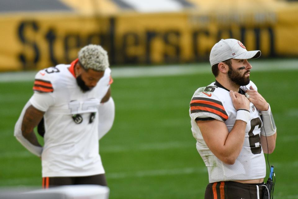 Cleveland Browns quarterback Baker Mayfield (6) and wide receiver Odell Beckham Jr. (13) on the sideline during the second half of an NFL football game against the Pittsburgh Steelers, Sunday, Oct. 18, 2020, in Pittsburgh. (AP Photo/Don Wright)