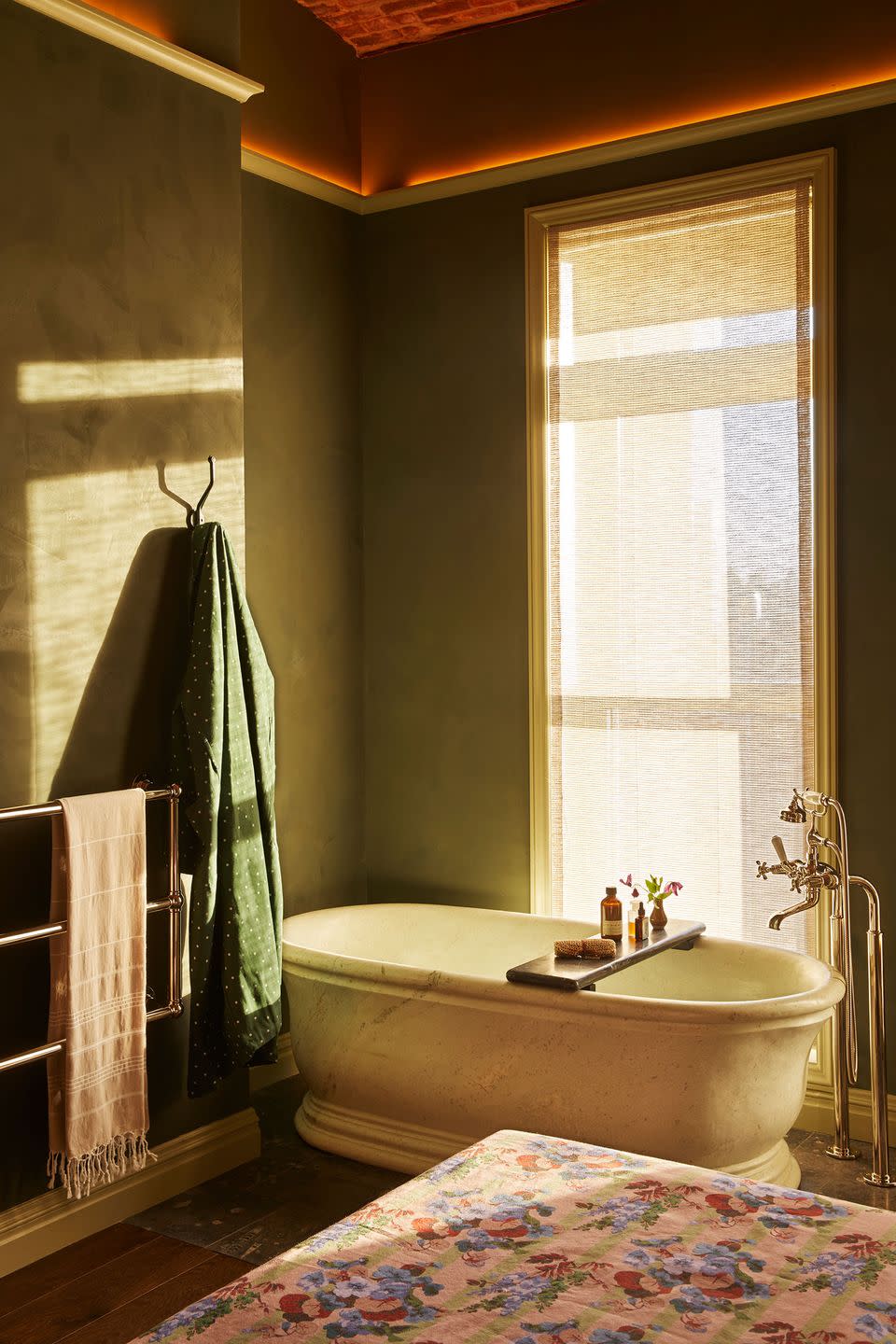 a bathroom with a tub and a window