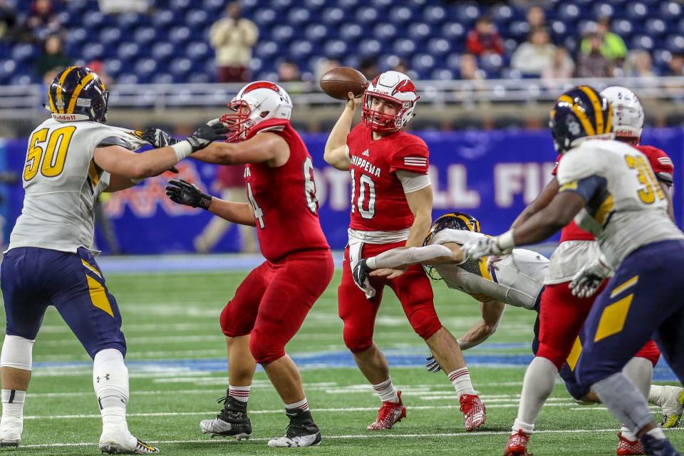 Chippewa Valley quarterback Tommy Schuster throws the ball against Clarkston during the Division 1 MHSAA state championship at Ford Field in Detroit on Saturday, Nov. 24, 2018.