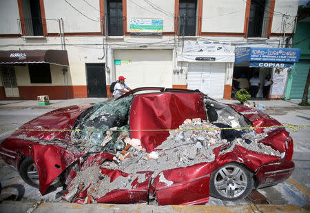 A car covered in rubble is seen after an earthquake, in Jojutla de Juarez, Mexico September 21, 2017. REUTERS/Edgard Garrido