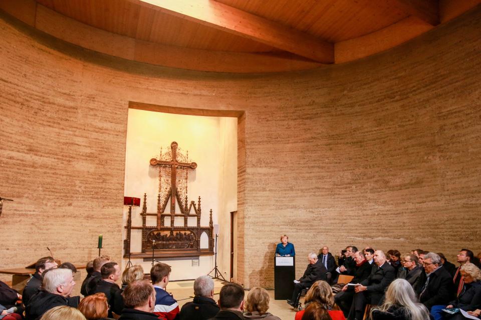 German Chancellor Angela Merkel speaks during a prayer in the Chapel of Reconciliation for the celebrations of the 30th anniversary of the fall of the Berlin Wall at the Berlin Wall Memorial site along Bernauer street in Berlin, Germany. Nov. 9, 2019