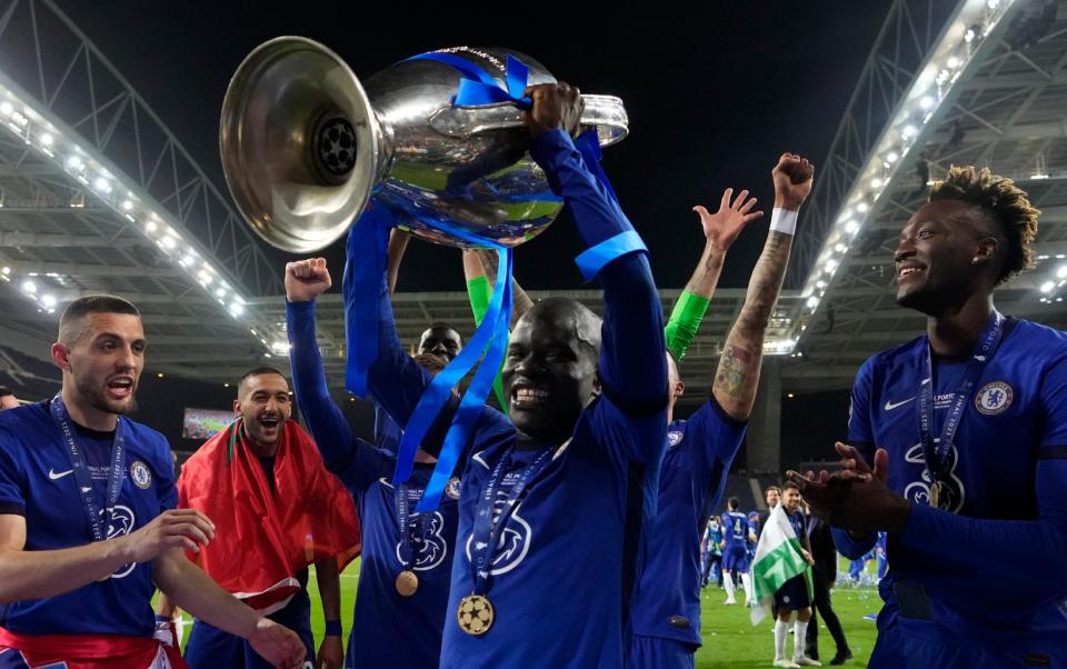 Chelsea's N'Golo Kante celebrates with the trophy after winning the Champions League final soccer match between Manchester City and Chelsea at the Dragao Stadium in Porto