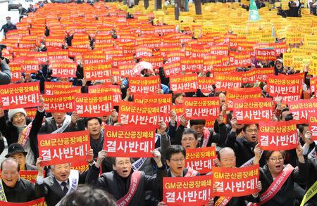 GM Korea workers from the Gunsan factory protest in Seoul, South Korea March 9, 2018. Yonhap via REUTERS/Files