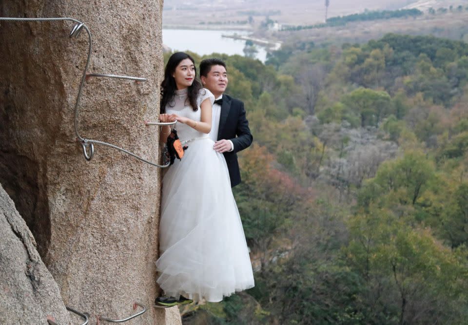 This couple decided to scale a cliff for their wedding photos. Photo: Australscope