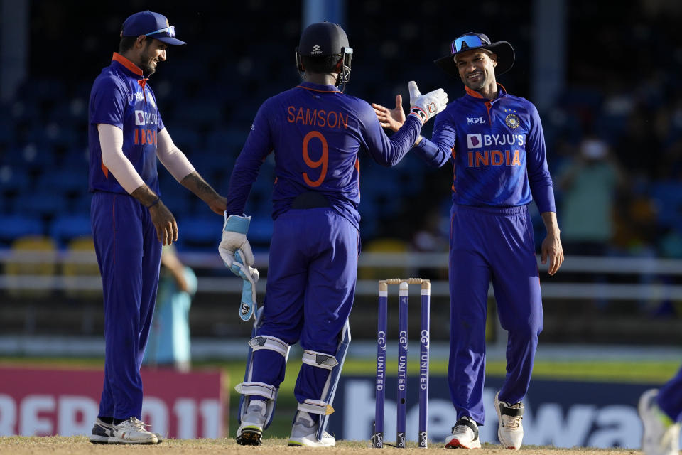India's captain Shikhar Dhawan, right, celebrates with keeper India's Sanju Samson after winning by 119 runs the third ODI cricket match against West Indies at Queen's Park Oval in Port of Spain, Trinidad and Tobago, Wednesday, July 27, 2022. (AP Photo/Ricardo Mazalan)