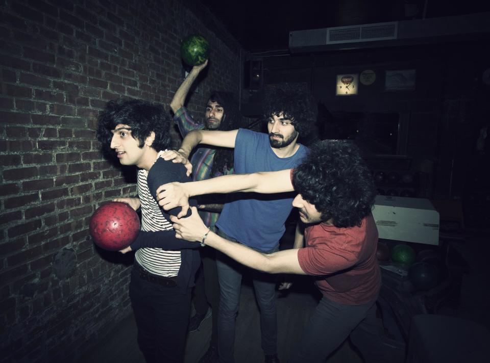 This 2012 photo shows Yellow Dogs band members, from left, Koroush "Koory" Mirzaei, Siavash Karampour, Arash Farazmand and Soroush Farazmand at The Gutter in the Brooklyn borough of New York. Police say a musician who shot and killed three other Iranian men inside a New York City apartment before committing suicide was upset because he had been kicked out of an indie rock band. Ali Akbar Mohammadi Rafie gunned down the men just after midnight on Monday, Nov. 11, 2013. Victims Soroush and Arash Farazmand were brothers who played in a band called the Yellow Dogs. The third victim, Ali Eskandarian was also a musician. After the shooting, investigators found a guitar case on a rooftop they believe the shooter may have used to carry the assault rifle used in the attack. (AP Photo/Danny Krug) NO SALES