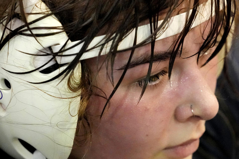 North Central women's wrestling team's Haley Vann takes a break during a practice at North Central College in Naperville, Ill., Monday, March 4, 2024. The team is a national powerhouse even though the program is only a few years old and the school is D-III. (AP Photo/Nam Y. Huh)