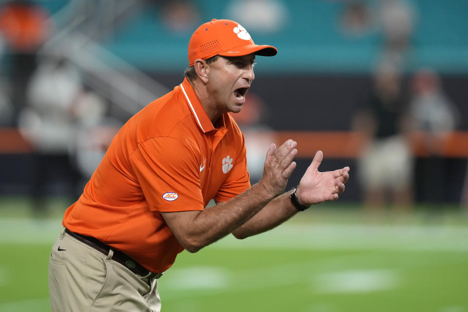 FILE - Clemson head coach Dabo Swinney walks on the field before an NCAA college football game against Miami, Saturday, Oct. 21, 2023, in Miami Gardens, Fla. Clemson's offense is searching for playmakers this season after a year when the team's mistakes had them at 4-4 and out of ACC title contention by the end of October. The Tigers rallied for five straight victories, but don't want to dig a similar hole this season. (AP Photo/Lynne Sladky, File)