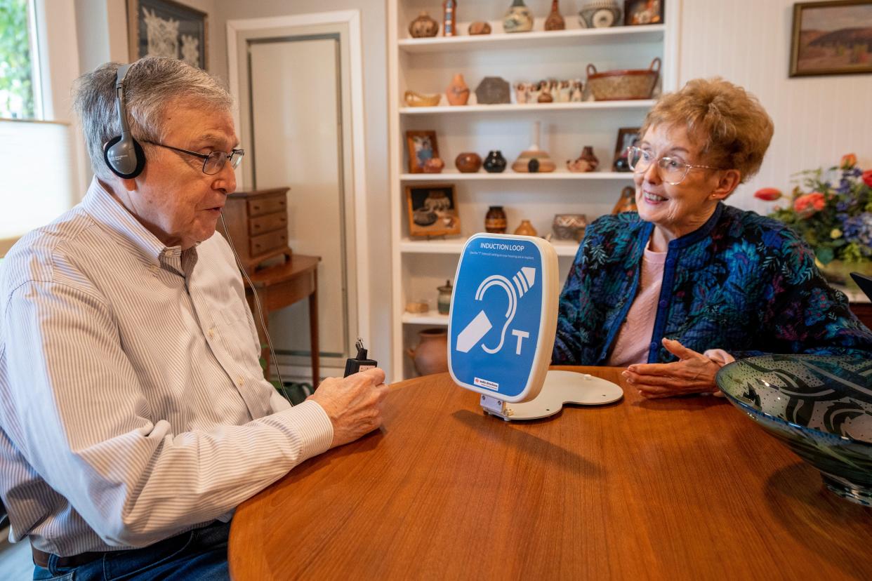 Catherine O'Shea demonstrates how an induction loop hearing device works with her husband, Art, at their Cedar Crest home in Pequannock, NJ on Friday, September 22, 2023. O'Shea is educating people living at Cedar Crest on how to live better with hearing loss.
