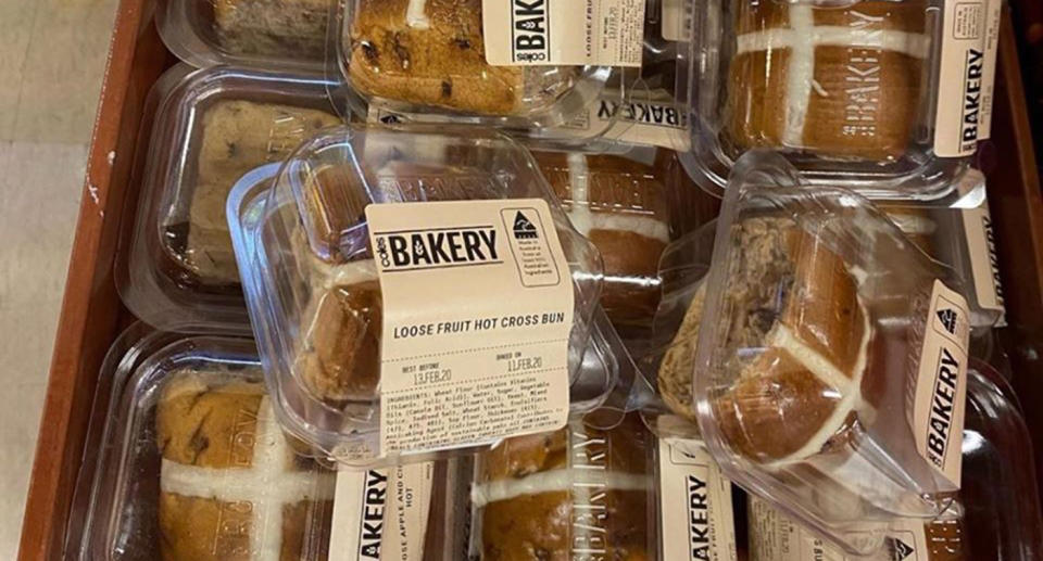Coles supermarket selling loose hot cross buns in plastic packaging.