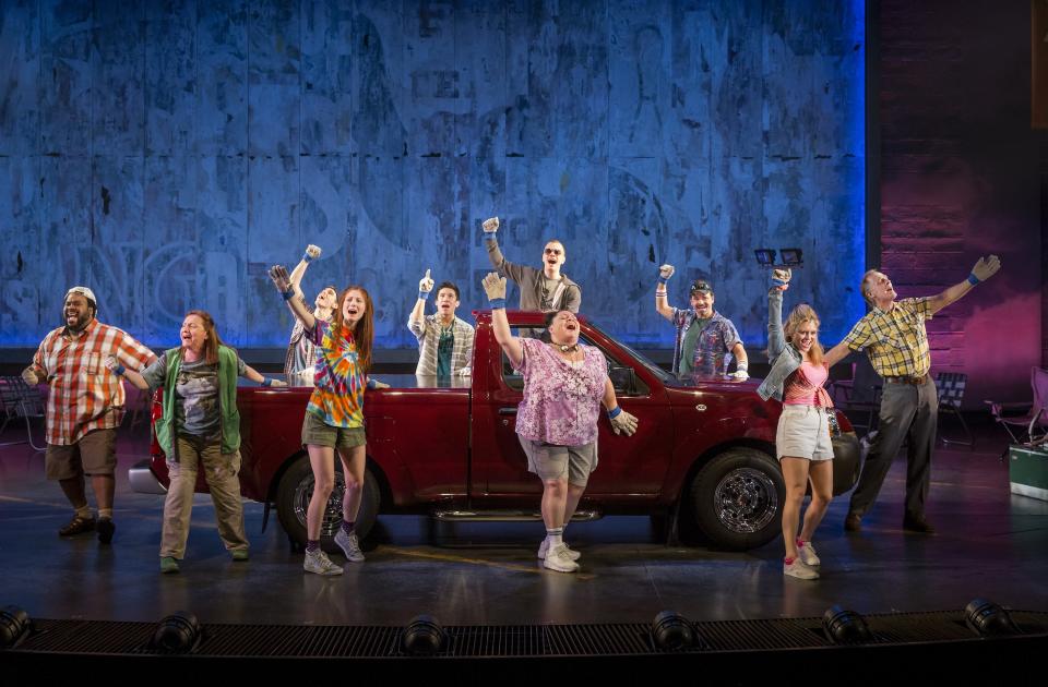 This theater image released by The Hartman Group shows the cast during a performance of "Hands on a Hard Body," at the Brooks Atkinson Theater in New York and featuring songs co-written by Phish frontman Trey Anastasio. (AP Photo/The Hartman Group, Chad Batka)