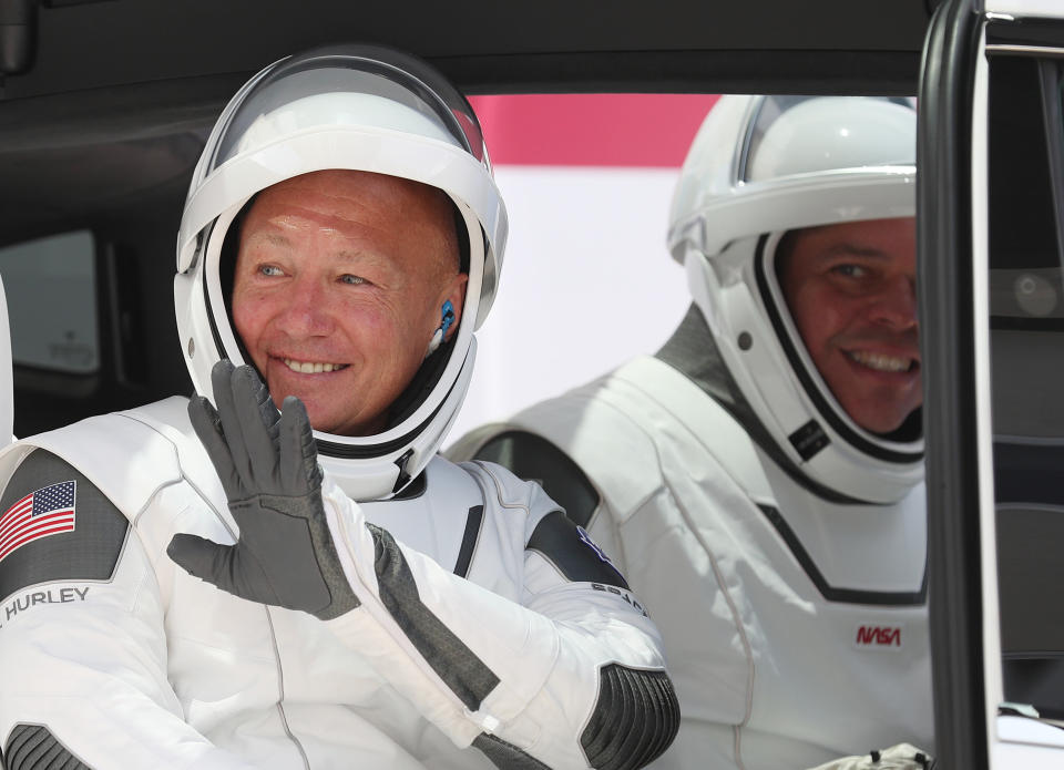 NASA astronauts Bob Behnken (right) and Doug Hurley, best friends, in a vehicle prior to the SpaceX launch on Saturday. (Photo: Joe Raedle via Getty Images)