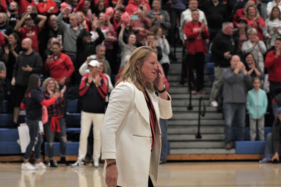 St. Henry head coach Maureen Kaiser wipes away tears after St. Henry defeated Notre Dame in the KHSAA Ninth Region volleyball championship Oct. 28, 2021.