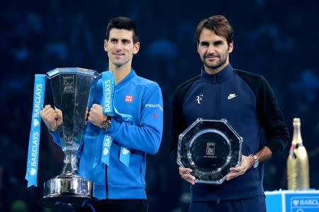 Tennis - Barclays ATP World Tour Finals - O2 Arena, London - 22/11/15 Men's Singles Final - Serbia's Novak Djokovic and Switzerland's Roger Federer pose with their trophies after their match Reuters / Suzanne Plunkett Livepic EDITORIAL USE ONLY.