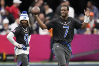 NFC quarterback Geno Smith (7) of the Seattle Seahawks reacts alongside NFC return specialist KaVontae Turpin (9) of the Dallas Cowboys during the flag football event at the NFL Pro Bowl, Sunday, Feb. 5, 2023, in Las Vegas. (AP Photo/John Locher)