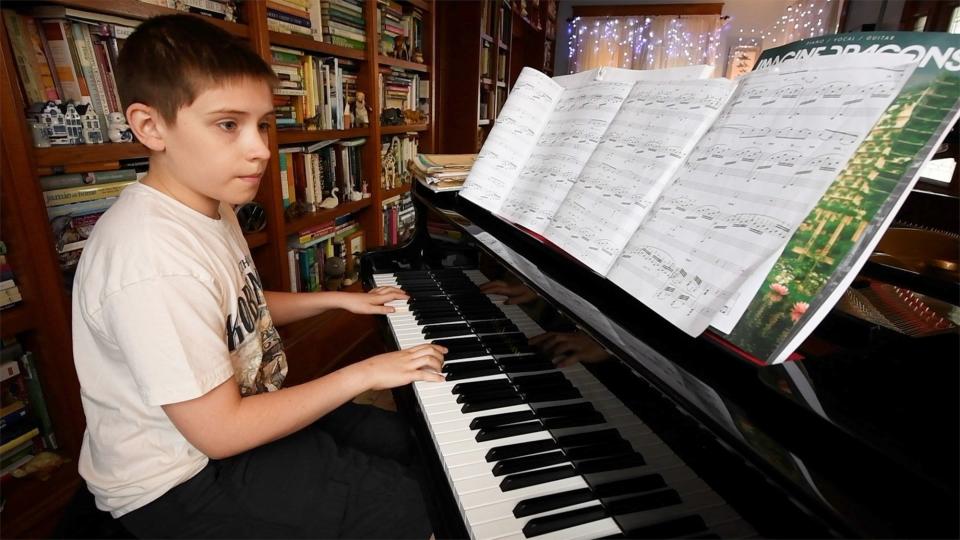 Tyler Spangler concentrates on a piano piece at his home in Windsor Township. He takes piano and drum lessons, playing a number of percussion instruments for the York Junior Symphony.