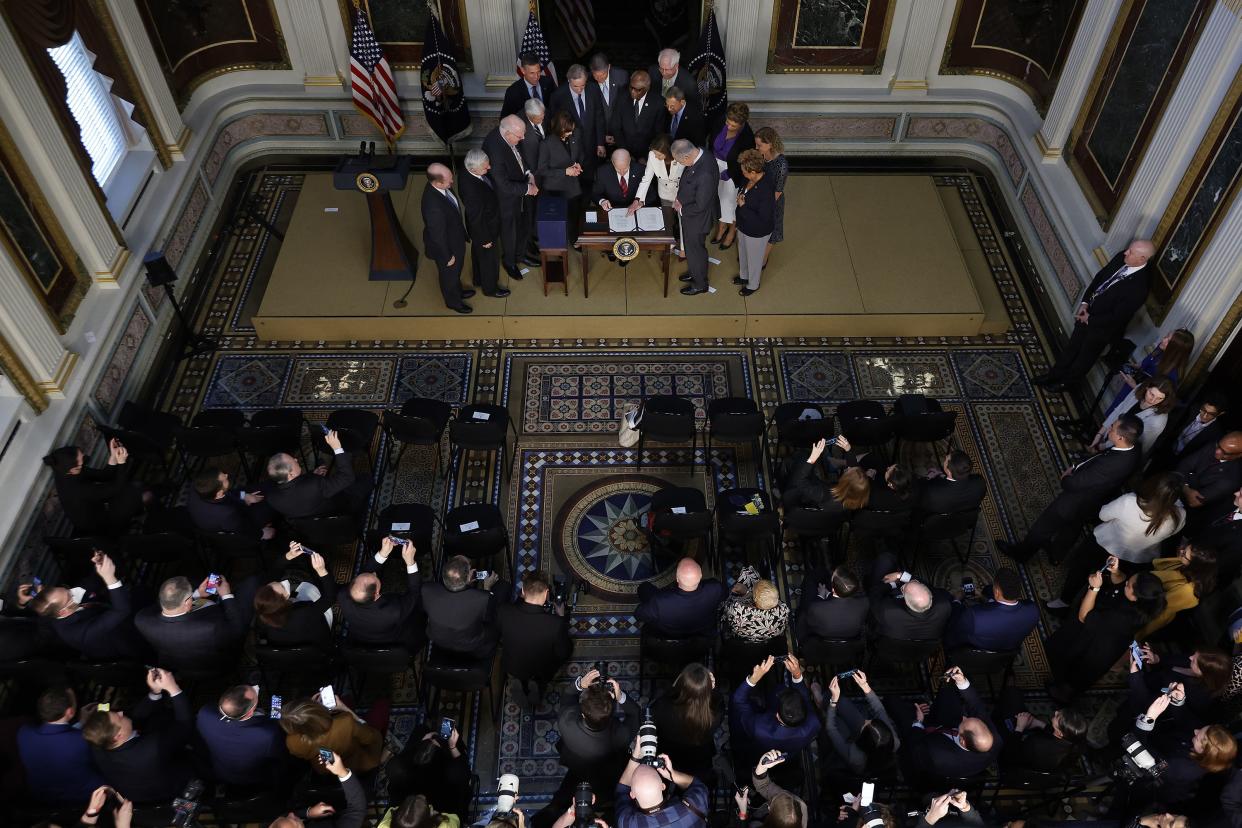 peaker of the House Nancy Pelosi (D-CA) points to the place where U.S. President Joe Biden is supposed to sign the “Consolidated Appropriations Act" in the Indian Treaty Room in the Eisenhower Executive Office Building on March 15, 2022, in Washington, DC. Averting a looming government shutdown, the $1.5 trillion budget, which includes $14 billion in humanitarian, military and economic assistance to Ukraine, will fund the federal government through September 2022.