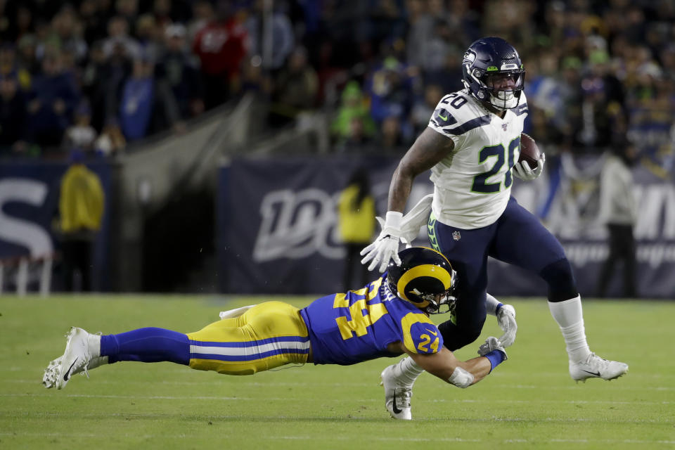 Seattle Seahawks running back Rashaad Penny, right, is tackled by Los Angeles Rams safety Taylor Rapp during the first half of an NFL football game Sunday, Dec. 8, 2019, in Los Angeles. (AP Photo/Marcio Jose Sanchez)