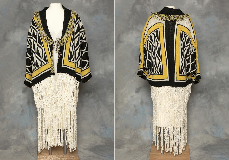 This combination of photos provided by the Sealaska Hertiage Institute in Juneau, Alaska, shows the front and back of a Tlingit Ravenstail coat. An Alaska Native cultural organization and the luxury department store Neiman Marcus have settled a lawsuit over the sale of a coat with a copyrighted, geometric design borrowed from indigenous culture. (Brian Wallace/Sealaska Heritage Institute via AP)