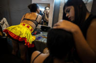 Contestants get ready for the Miss Trans Northeast 22, beauty pageant in Guwahati, India, Wednesday, Nov. 30, 2022. In a celebration of gender diversity and creative expression, a beauty pageant in eastern Indian state of Assam brought dozens of transgender models on stage in Guwahati. Sexual minorities across India have gained a degree of acceptance especially in big cities and transgender people were given equal rights as a third gender in 2014. But prejudice against them persists and the community continues to face discrimination and rejection by their families. (AP Photo/Anupam Nath)
