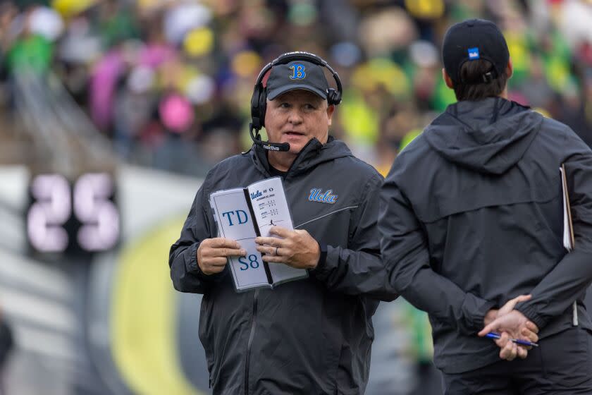 Head coach of the UCLA Bruins Chip Kelly stands on the sidelines during a game against the Oregon Ducks.