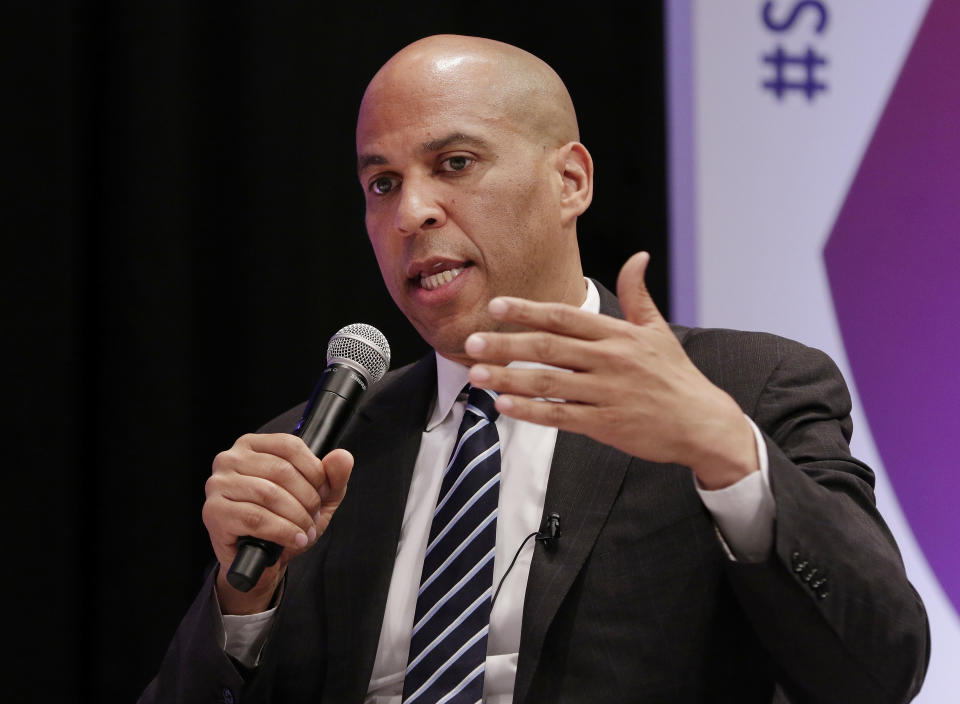 FILE- In this April 24, 2019 file photo, Democratic presidential candidate Sen. Cory Booker, D-N.J., answers questions during a presidential forum on the Texas State University campus in Houston. Booker has proposed a national marijuana legalization measure that includes expungements of criminal records for marijuana offenses. (AP Photo/Michael Wyke, File)