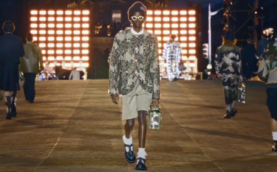 A model wears Louis Vuitton Men’s “Damoflage” tweed collarless jacket on the runway during the Louis Vuitton Spring 2024 Menswear Collection Runway Show on June 20, 2023, in Paris. (Screenshot: Louis Vuitton/YouTube)