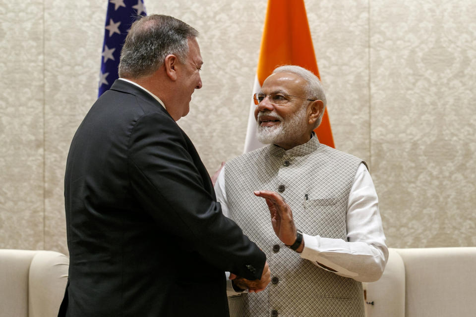 Secretary of State Mike Pompeo, left, shakes hands with Indian Prime Minister Narendra Modi, during their meeting at the Prime Minister's Residence in New Delhi, India, Wednesday, June 26, 2019. Pompeo arrived in India's capital late Tuesday after visiting Saudi Arabia, the United Arab Emirates and Afghanistan on a trip aimed at building a global coalition to counter Iran. (AP Photo/Jacquelyn Martin, Pool)
