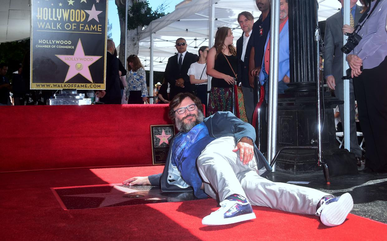 Actor Jack Black poses on his Hollywood Walk of Fame Star during a ceremony on September 18, 2018 in Hollywood, California. (Photo by Frederic J. BROWN / AFP)        (Photo credit should read FREDERIC J. BROWN/AFP via Getty Images)
