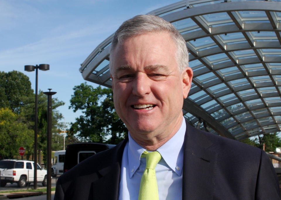 FILE - David Trone stands in front of the Shady Grove Metro stop in Derwood, Md., June 14, 2018. Trone, the wealthy founder of Total Wine and More who has invested more than $23 million in his own campaign, is running in the Democratic primary against Angela Alsobrooks, the chief executive in Prince George's County. Republicans hoping to pick up an open U.S. Senate seat in deep blue Maryland have the most competitive candidate they've had in decades in former Gov. Larry Hogan. (AP Photo/Brian Witte, File)