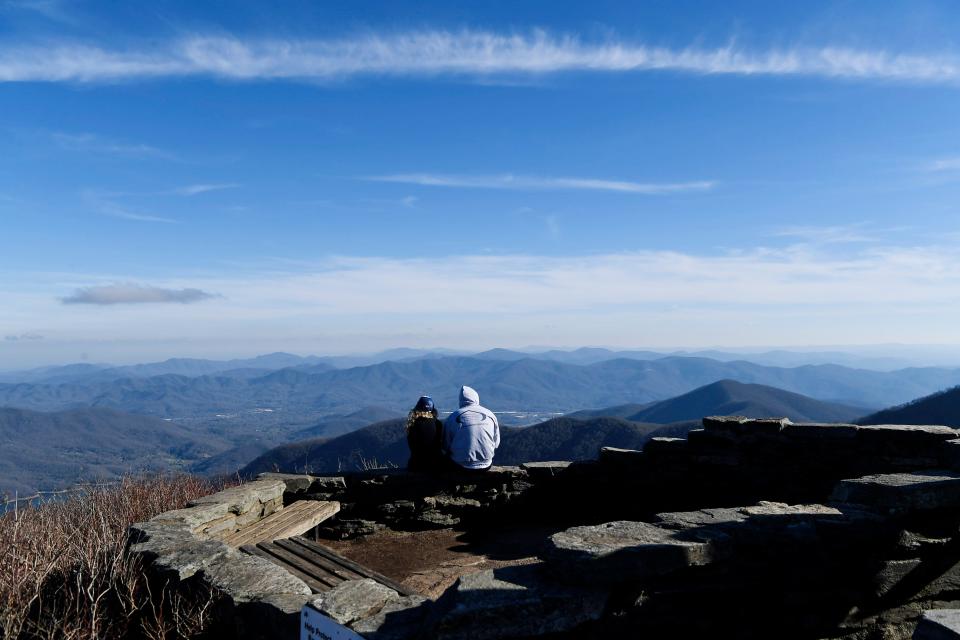 A couple enjoys the view at Craggy Gardens along the Blue Ridge Parkway March 26, 2020. The Nantahala-Pisgah Forest Plan includes a designation of the Craggy area near Asheville as a Forest Scenic Area, a designation that could help it become the state's first National Scenic Area.