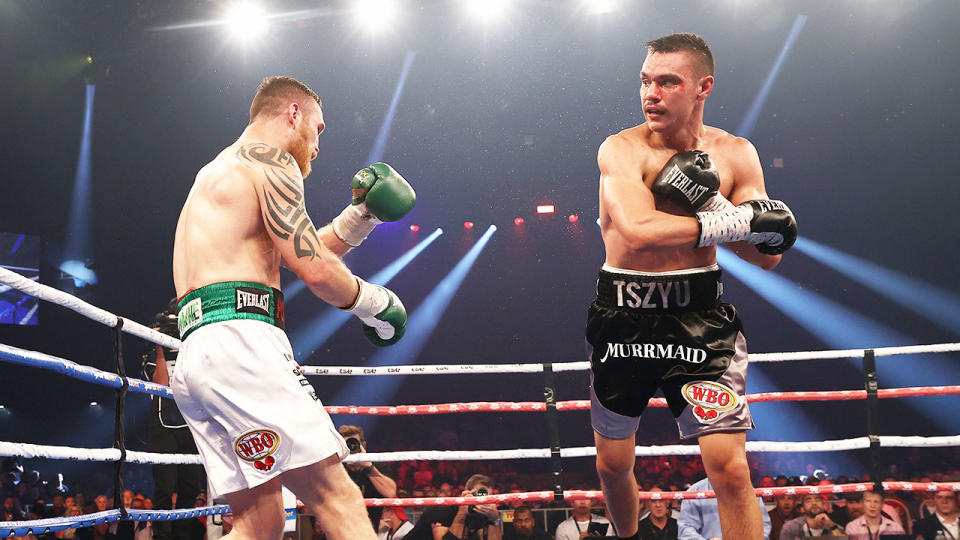 Seen here, Tim Tszyu knocks out Irishman Dennis Hogan in their 2021 fight.