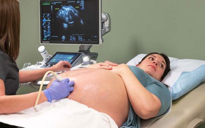 Kelsey Hatcher undergoes a scan during her pregnancy
