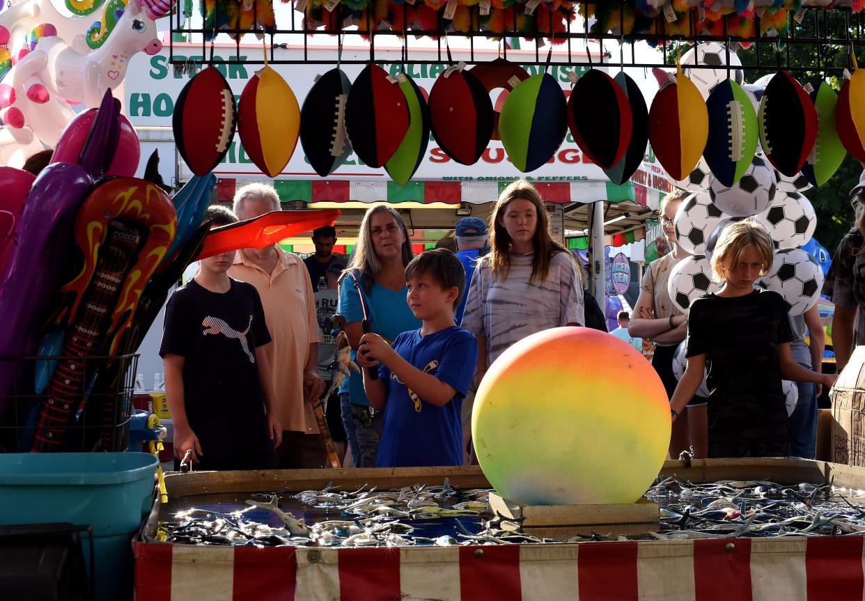 Avery Ringhiser, 8, wins a prize at a fishing game on Aug. 18, 2022, at the 75th annual Pataskala Street Fair supporting West Licking Firefighters Association. The 2023 fair opens Aug. 16.