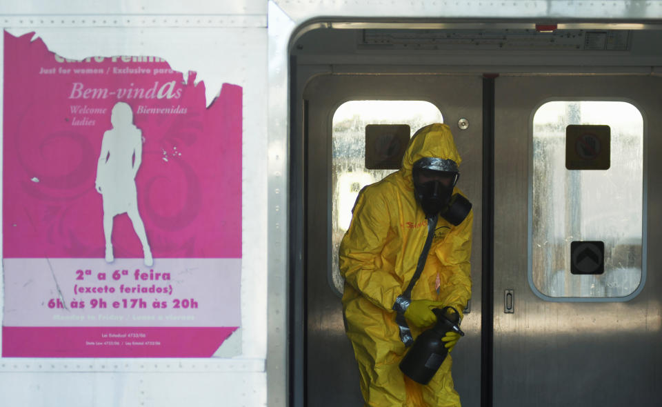 Member of the armed forces disinfects a train car during the coronavirus disease (COVID-19) outbreak, at the Brazil's Central station in Rio de Janeiro