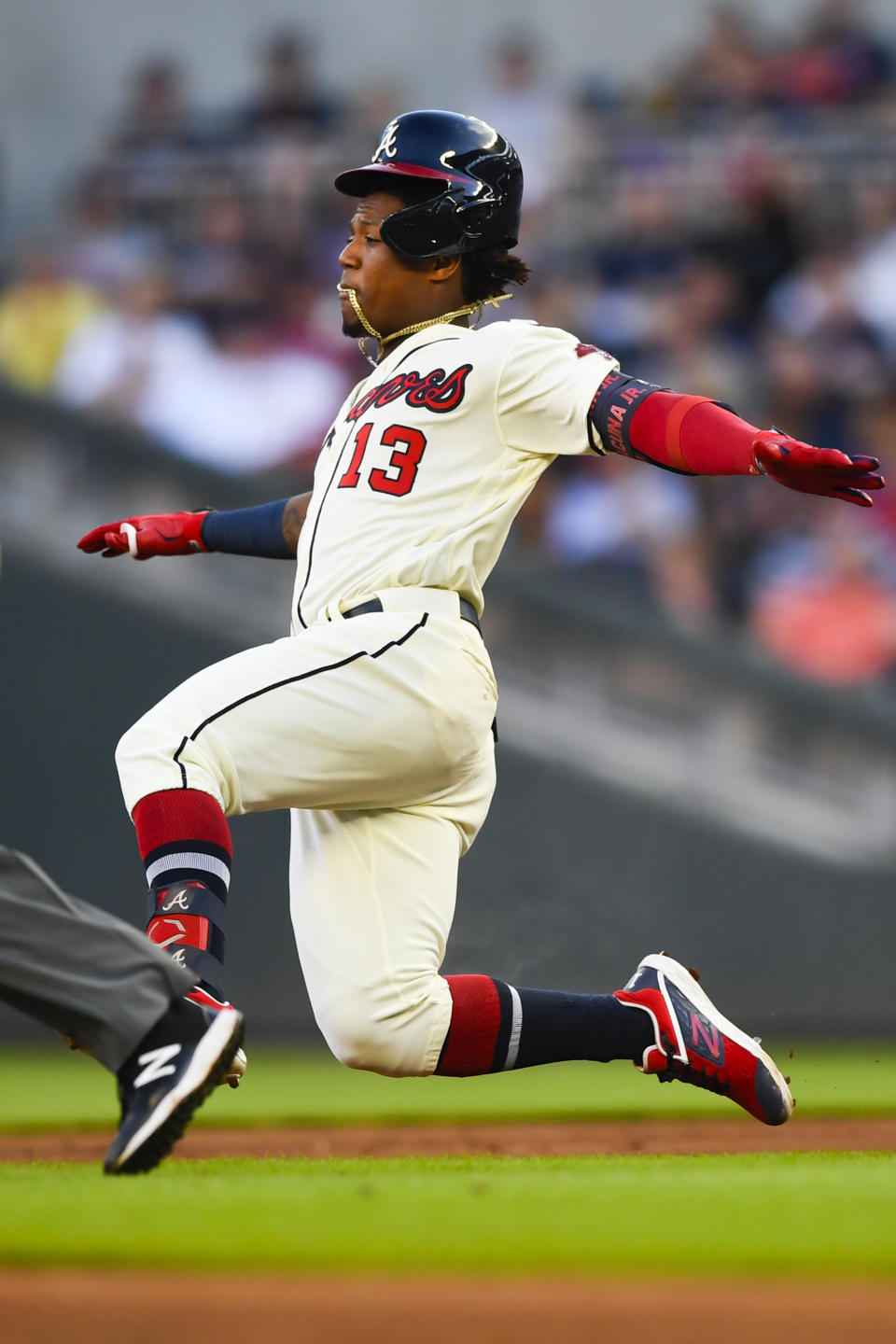 Atlanta Braves' Ronald Acuna Jr. leaps into a dive to second base before being tagged out attempting a double on a line drive to center field during the second inning of a baseball game against the Washington Nationals, Sunday, July 21, 2019, in Atlanta. (AP Photo/John Amis)