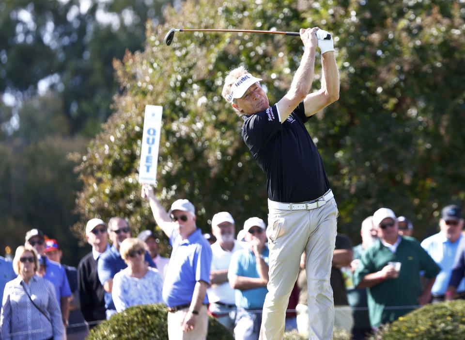 Bernhard Langer looks on his tee shot at the 10th hole during the second day of the Dominion Energy Charity Classic golf tournament at Country Club of Virginia on Saturday, Oct. 23, 2021, in Richmond, Va. (Daniel Sangjib Min/Richmond Times-Dispatch via AP)