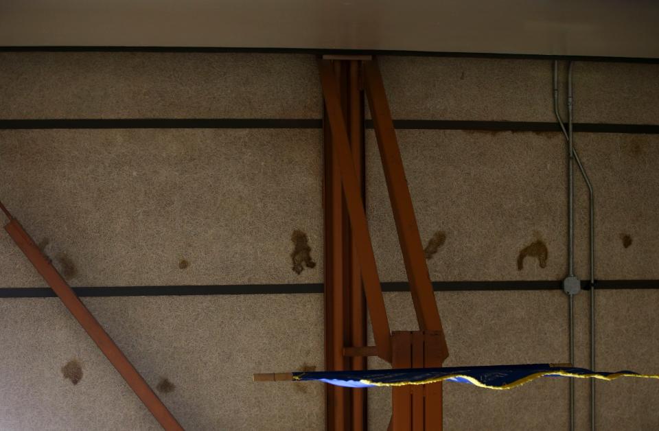 Water spots are scattered on the ceiling of Gervais High School's gymnasium on March 28. After heavy rainfall, water leaks onto the gym floor.