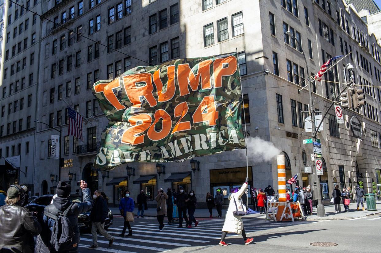 <span class="caption">Supporters of former President Trump gather outside of Trump Tower during a rare visit Trump made to his New York offices, March 8, 2021.</span> <span class="attribution"><a class="link " href="https://www.gettyimages.com/detail/news-photo/supporters-of-former-president-trump-gather-outside-of-news-photo/1306020725?adppopup=true" rel="nofollow noopener" target="_blank" data-ylk="slk:Andrew Lichtenstein/Corbis via Getty Images;elm:context_link;itc:0;sec:content-canvas">Andrew Lichtenstein/Corbis via Getty Images</a></span>