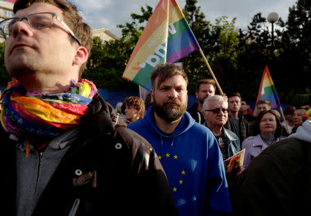 People gather during a protest in support of Elzbieta Podlesna, the author of an image depicting the Virgin Mary with a rainbow-coloured halo, reminiscent of the LGBT flag, who was detained for offending religious beliefs, in Warsaw, Poland May 7, 2019. REUTERS/Kacper Pempel