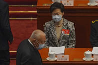 Hong Kong Chief Executive Carrie Lam, top, and former Hong Kong Chief Executive Tung Chee-hwa arrive to the opening session of China's National People's Congress (NPC) at the Great Hall of the People in Beijing, Friday, March 5, 2021. China’s No. 2 leader has set a healthy economic growth target and vowed to make this nation self-reliant in technology amid tension with Washington and Europe over trade and human rights. (AP Photo/Andy Wong)