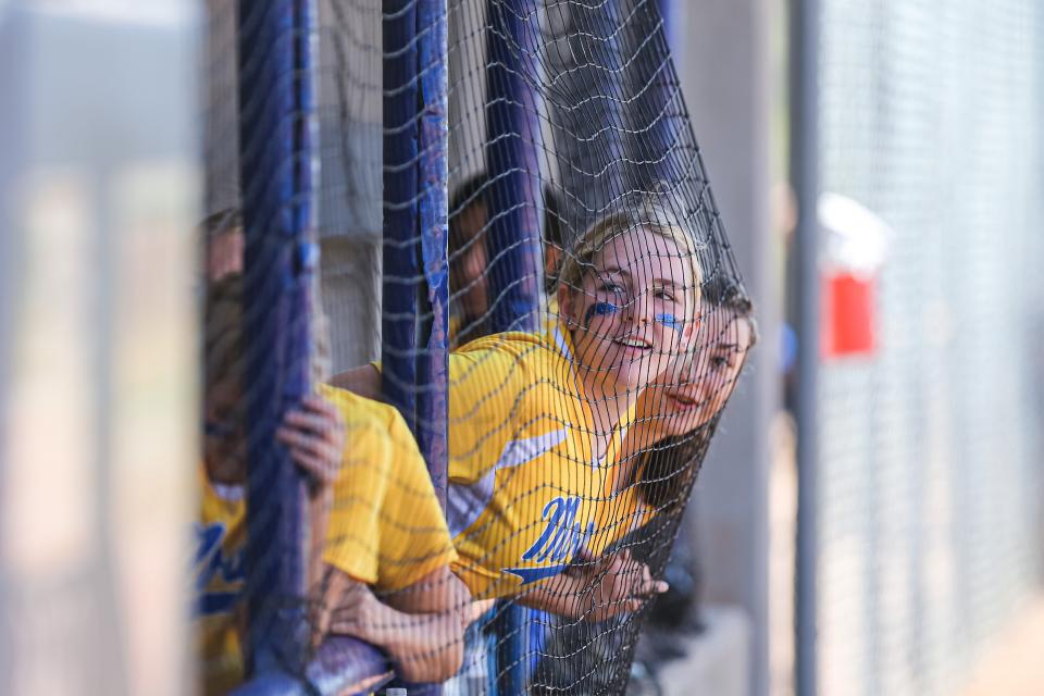 Moss players lean against the net during the Class B state fastpitch softball quarterfinals Thursday against Lookeba-Sickles High School at the USA Softball Hall of Fame Stadium Complex.