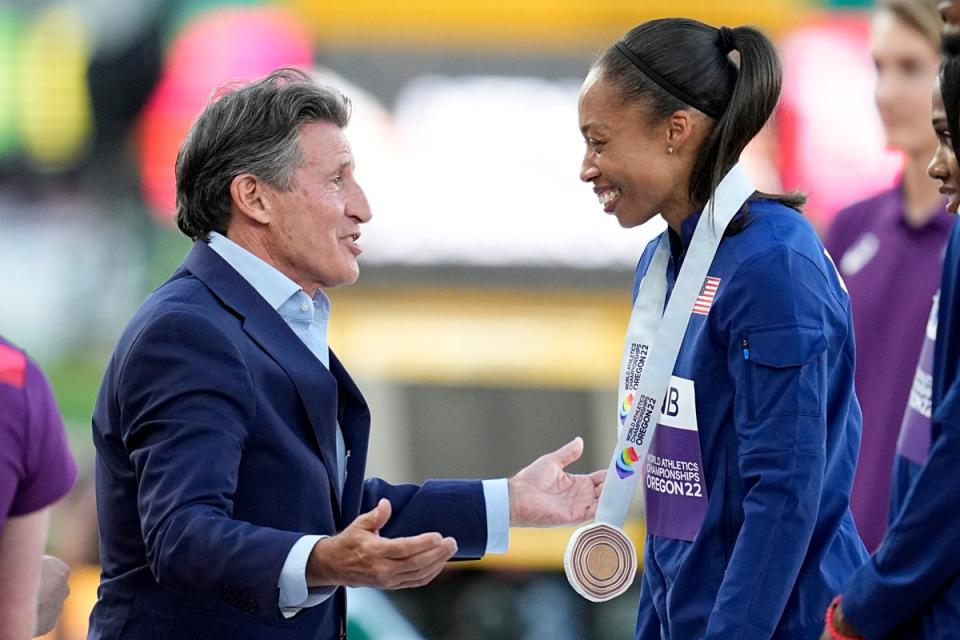 Lord Coe gives a bronze medal to Allyson Felix (Ashley Landis/AP) (AP)