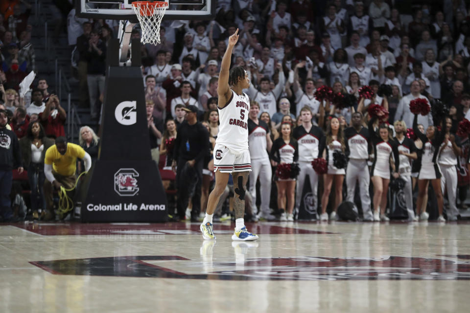 South Carolina guard Meechie Johnson (5) holds one finger in the air as the clock runs out during the second half of an NCAA college basketball game against Florida Saturday, March 2, 2024, in Columbia, S.C. South Carolina won 82-76. (AP Photo/Artie Walker Jr.)