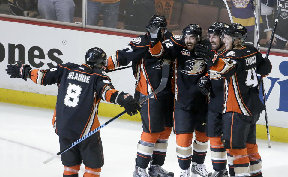 Members of the Anaheim Ducks celebrate Mathieu Perreault's goal during the second period in Game 5 of an NHL hockey second-round Stanley Cup playoff series against the Los Angeles Kings in Anaheim, Calif., Monday, May 12, 2014. (AP Photo/Chris Carlson)