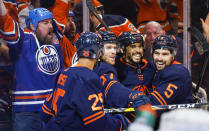 Edmonton Oilers winger Evander Kane, second right, celebrates his goal with teammates during the second period of an NHL hockey Stanley Cup second-round playoff series game in Edmonton, Alberta, Sunday, May 22, 2022. (Jeff McIntosh/The Canadian Press via AP)